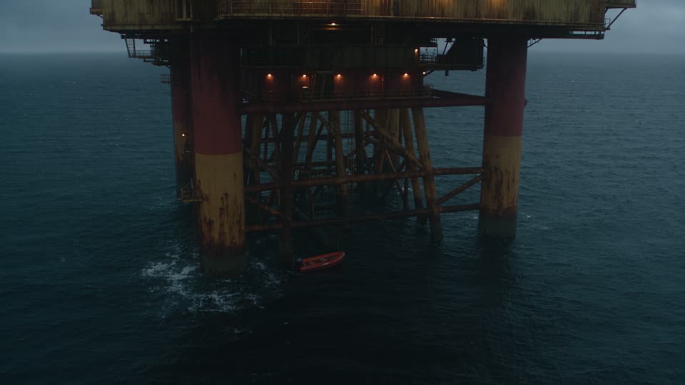 Dead Tide concept poster showing an offshore rig in a cold, dark sea